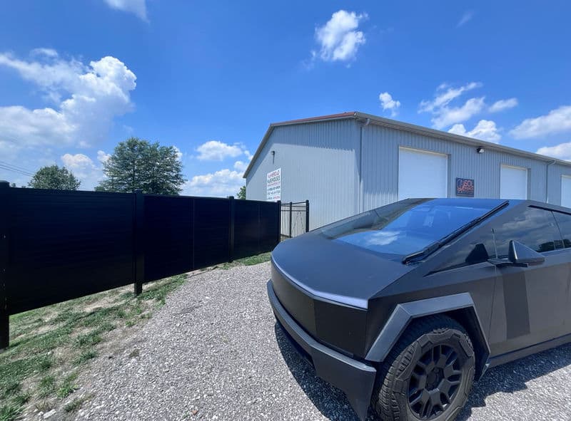 SOL Fence solar privacy fence with Tesla Cybertruck for EV charging