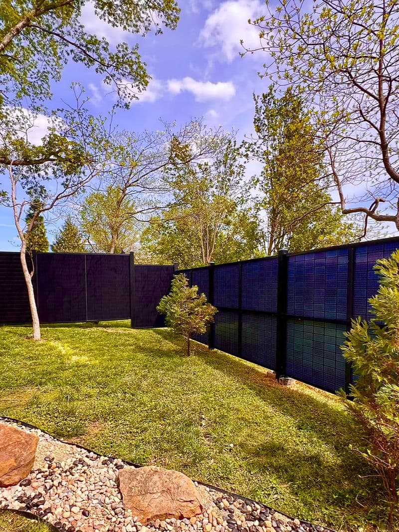 SOL Fence full privacy fence section with solar panels in a row
